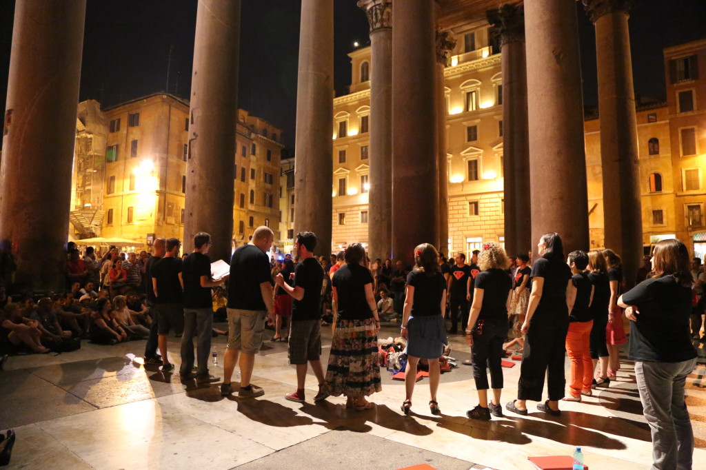 A choral group singing in the portico of the Pantheon.